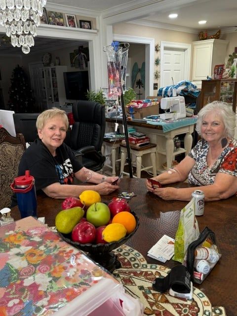 Two clients receiving mobile IV hydration together at home